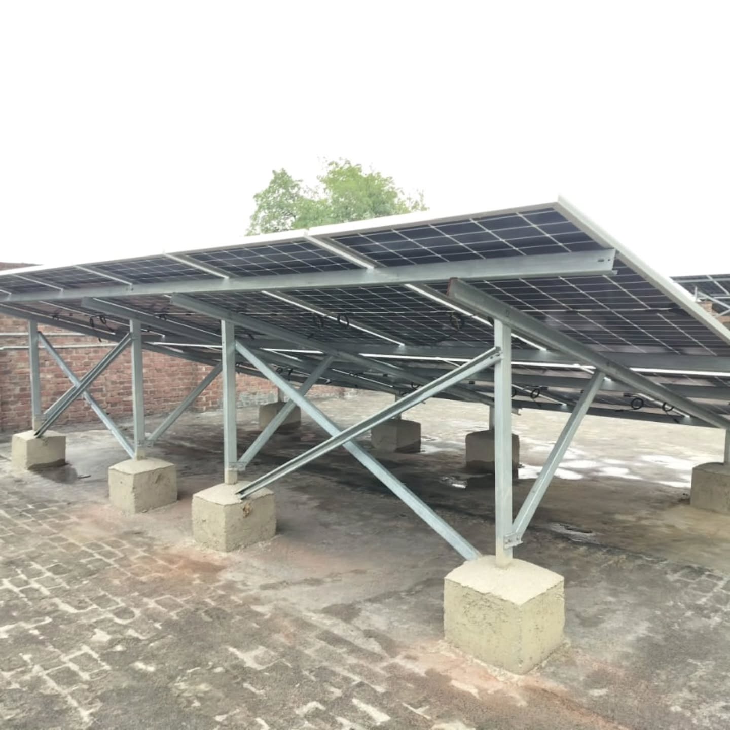 Solar panel racking system on brick rooftop in Raipur